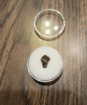 This is a 3/8" long Triceratops Tooth from the Hell Creek Formation in Garfield County, Montana. It is in good condition with no significant repair or restoration.  L-3/8" W-5/16"