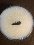 This is a unidentified Raptor Tooth from the Hell Creek Formation in Garfield County Montana. This tooth is in excellent condition. Length - 1/2"  Width - 1/4"   