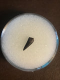 This is a unidentified Raptor Tooth from the Hell Creek Formation in Garfield County Montana. This tooth is in excellent condition. Length - 1/2"  Width - 1/4"   