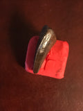  This is a 1" long Raptor tooth from the Hell Creek formation in Garfield County, Montana. It is in excellent condition with no significant repair or restoration.  L-1" W-1/2"  